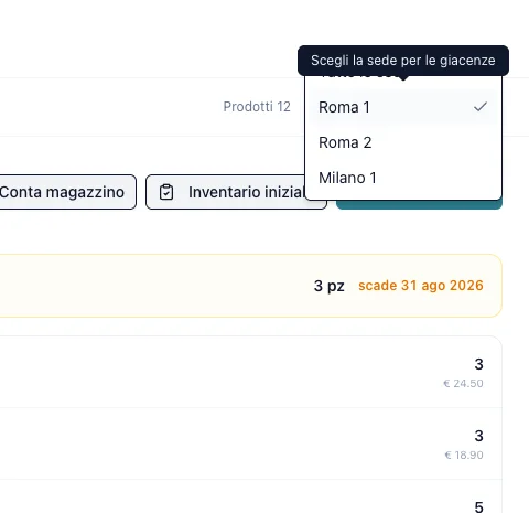 Menu «Scegli la sede per le giacenze» aperto sul magazzino, con Roma 1 spuntata accanto a Roma 2 e Milano 1 e le quantità della sede scelta